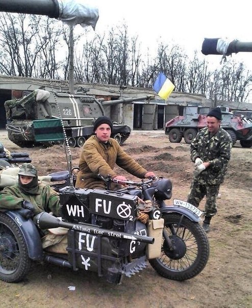 Ukrainian vehicles and soldiers