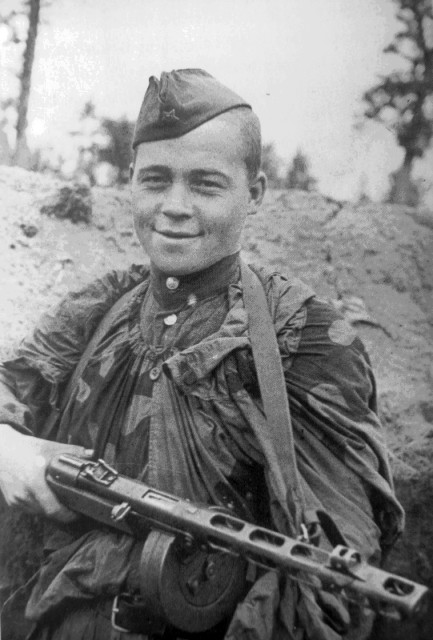 photo WWII Soviet soldier armed with the PPSh SMG